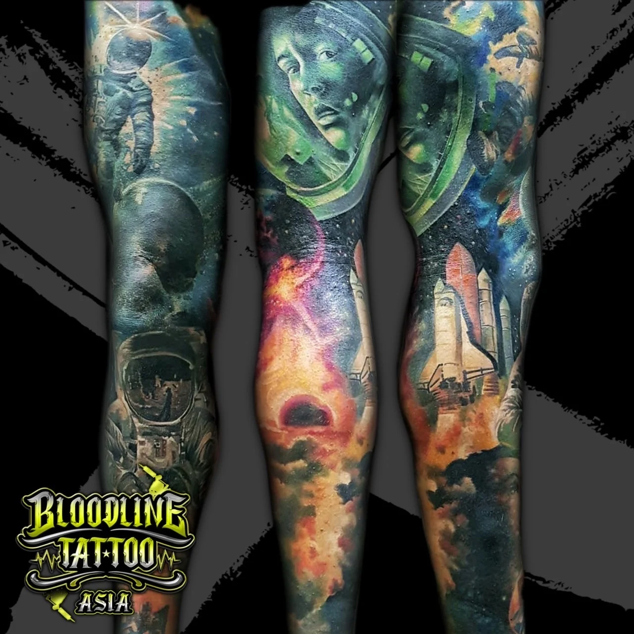Colour space-themed full arm sleeve tattoo with astronauts, a launching shuttle, and cosmic nebulas at Bloodline Tattoo Bangkok.