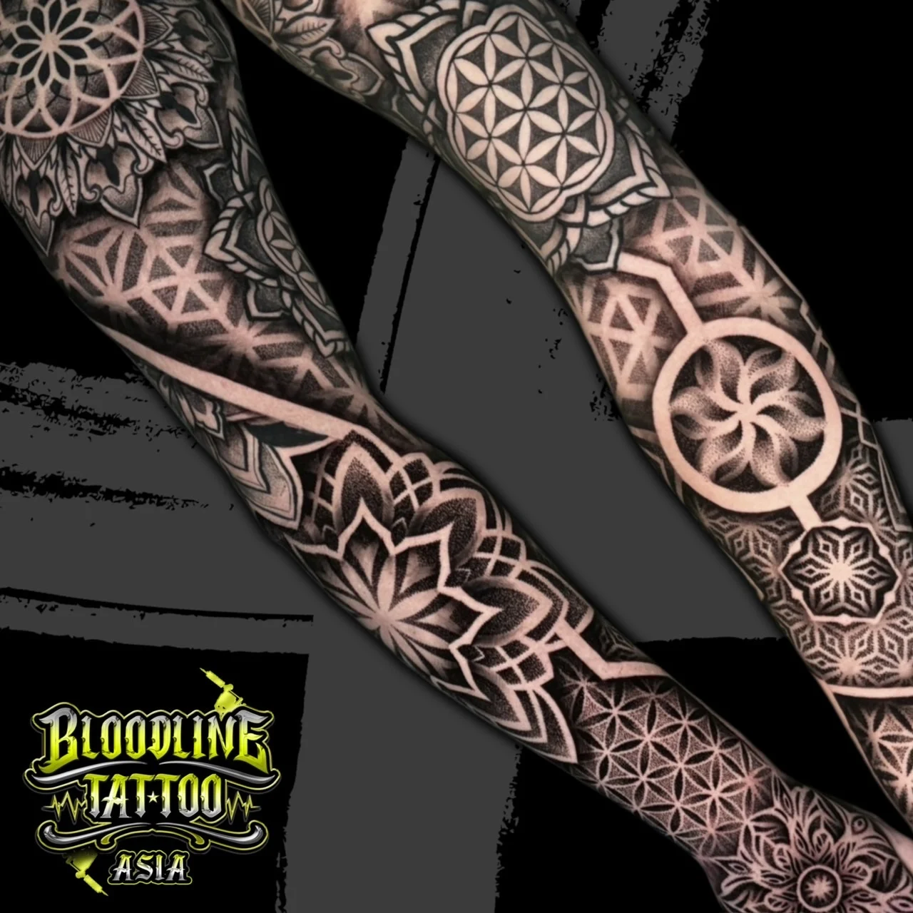 Dual-angle arm sleeve with floral mandalas, Flower of Life circles, and hexagonal tessellations in precision dotwork, at Bloodline Tattoo Bangkok.
