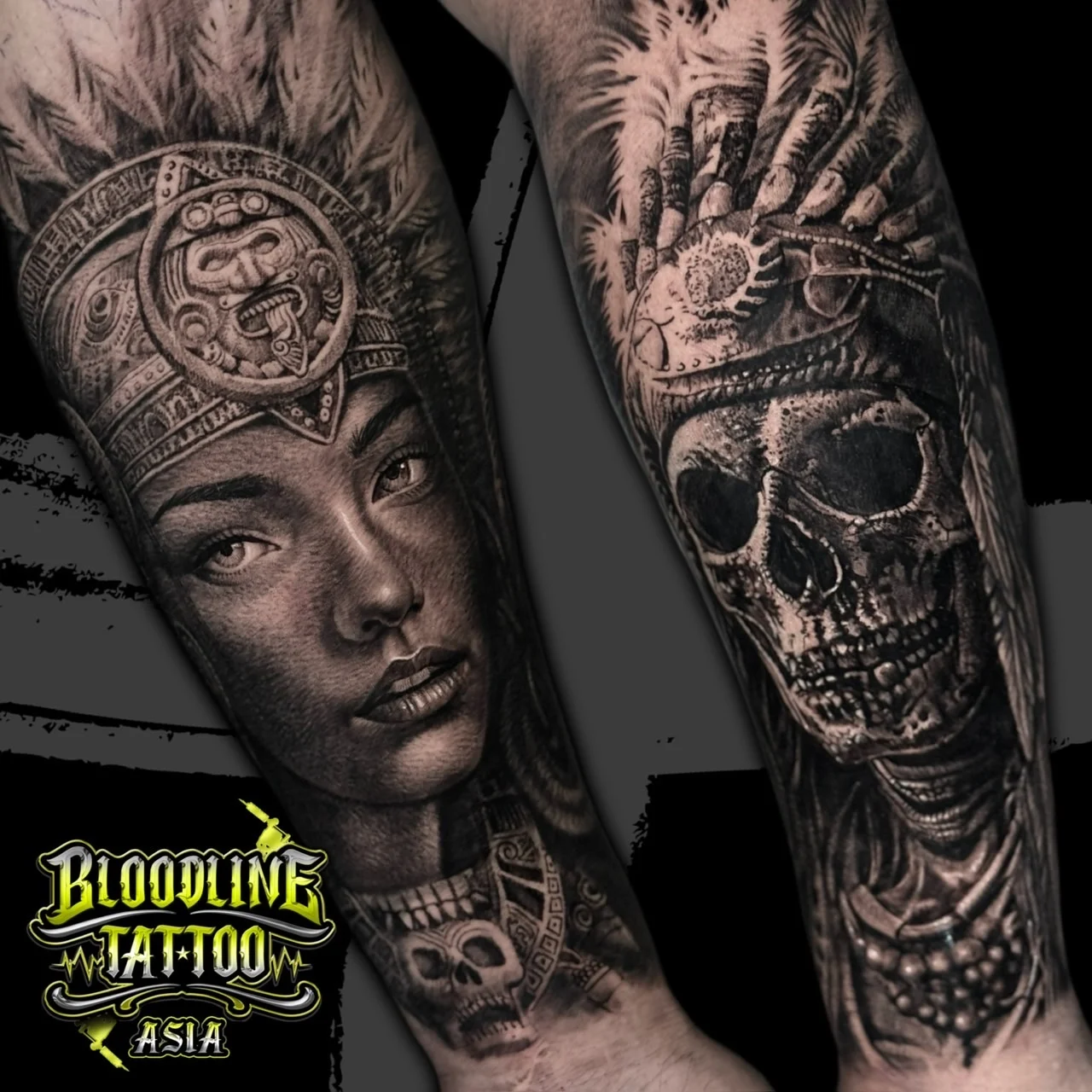 A black and grey realism sleeve pairing an indigenous woman in a feathered headdress with a skull wearing the same ornate headpiece, at Bloodline Tattoo Bangkok.